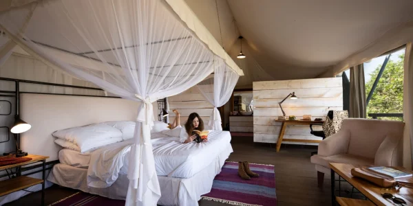 Mara Mara Tented Lodge a Woman In Queen Size Bed